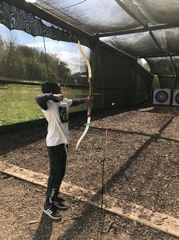 a child taking part in archery